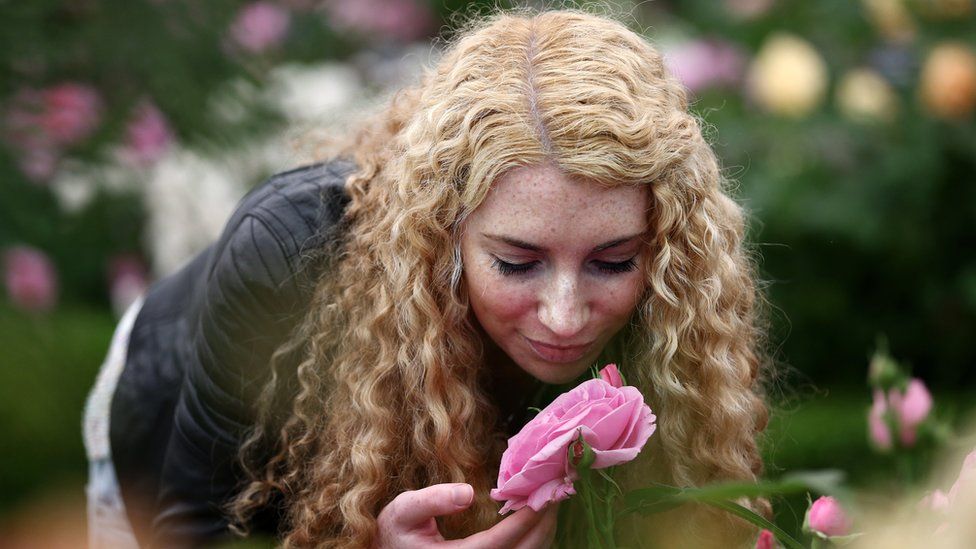 smelling a rose