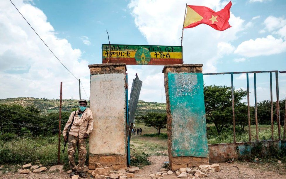 An armed member of the community security stands in front of a school where a polling station is located during Tigrays regional elections, in the town of Tikul, 15 kms east from Mekele, Ethiopia, on September 9, 2020.