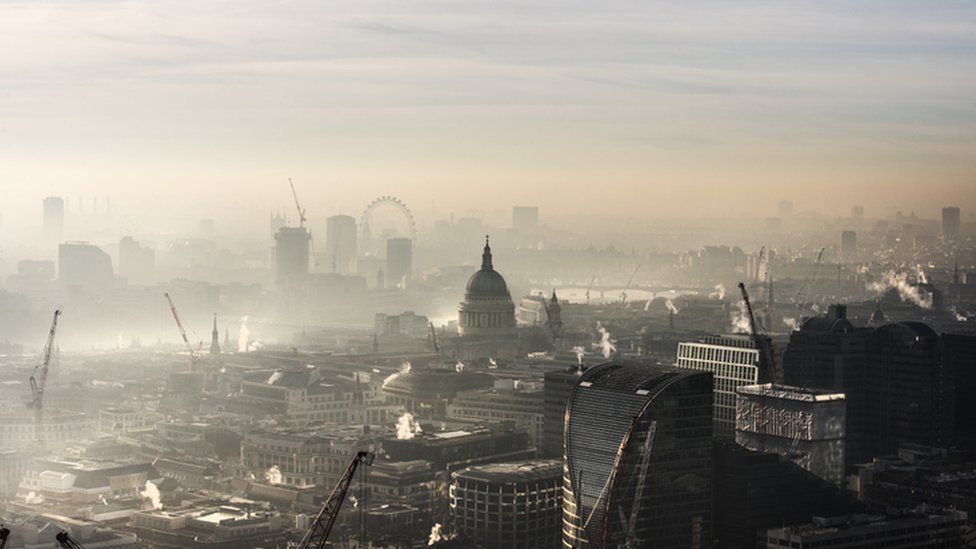 Smoggy rooftop view of modern London