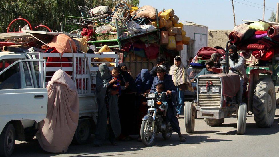 Afghans flee their villages after fighting intensified between Taliban militants and security forces, in Lashkar Gah, 12 October 2020.