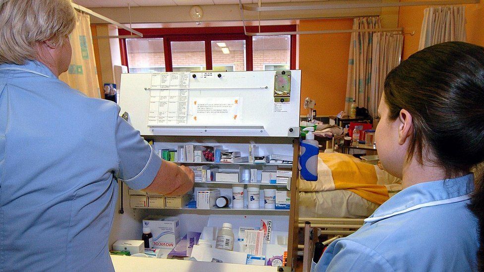 Nurses dispensing drugs