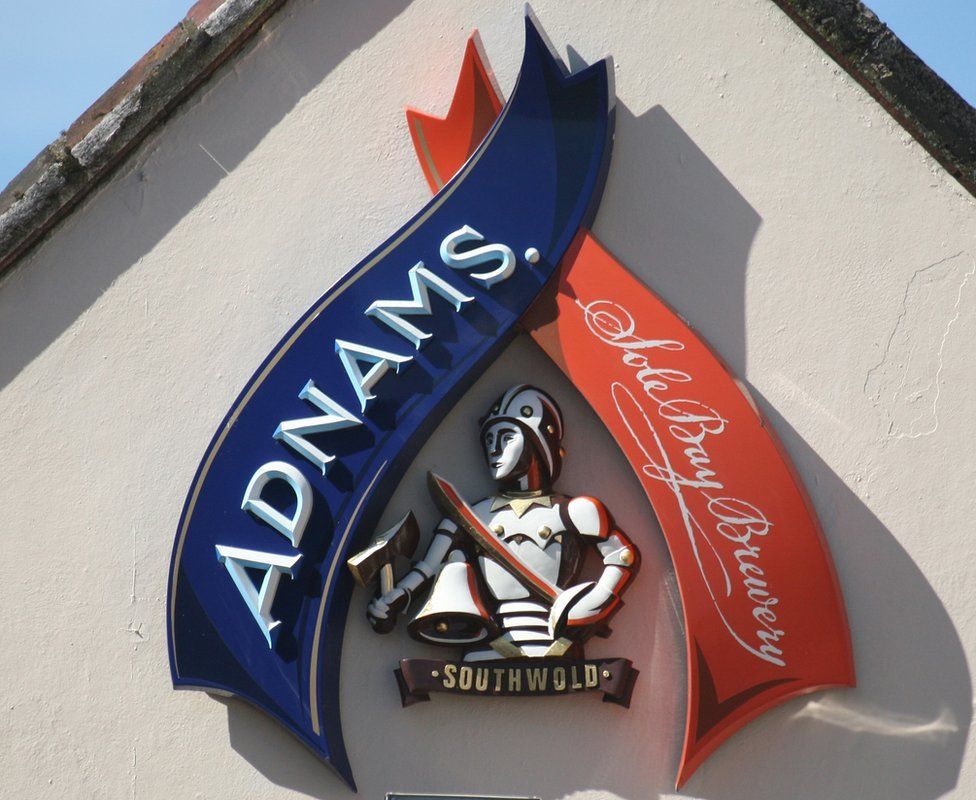 An Adnams brewery sign on a pub in Aldeburgh.