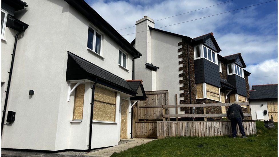 Boarded up windows on new build homes