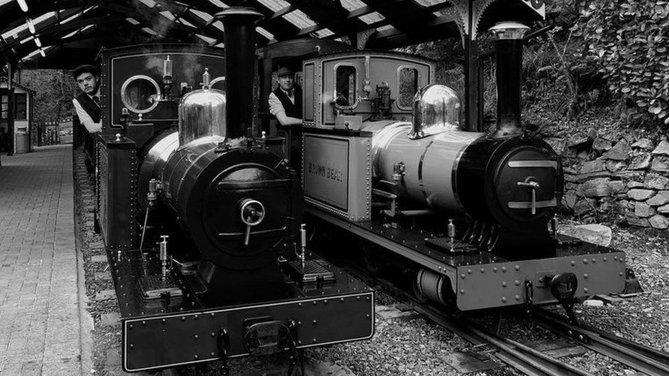 Two engines with drivers in period dress
