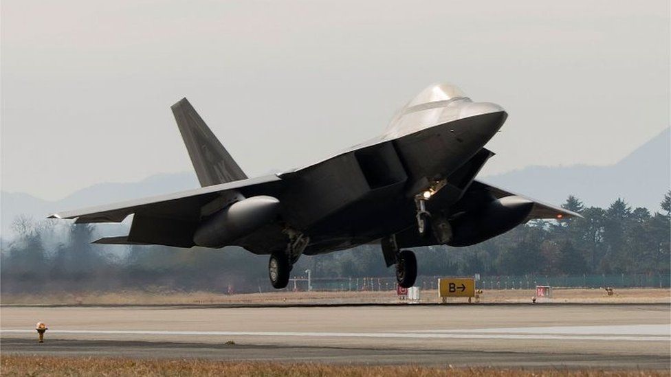 In this handout image taken on December 2 by US Air Force and released on 4 December, A US Air Force F-22 Raptor fighter jet touching down at Gwangju Air Base on 2 December 2017 in Gwangju, South Korea.
