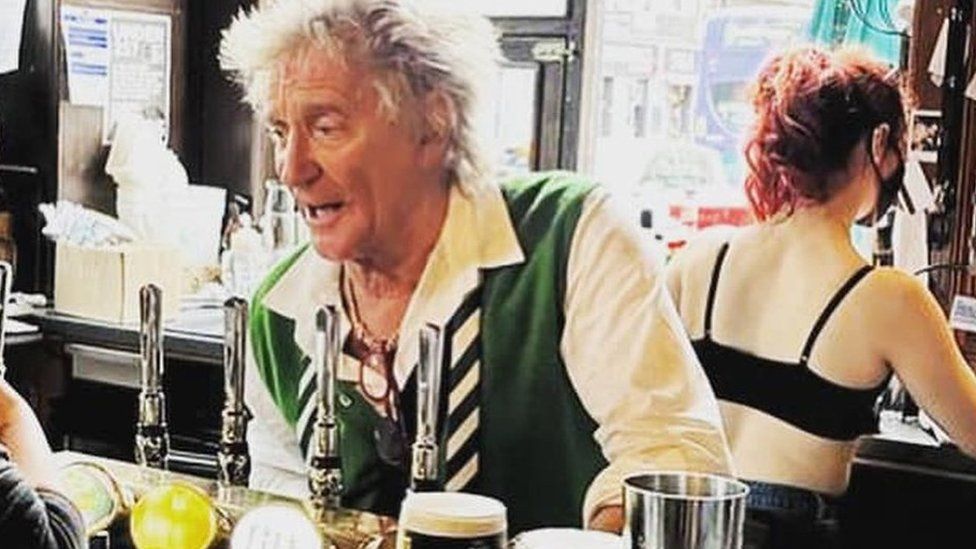 Rod Stewart serving drinks in the Dirty Duchess