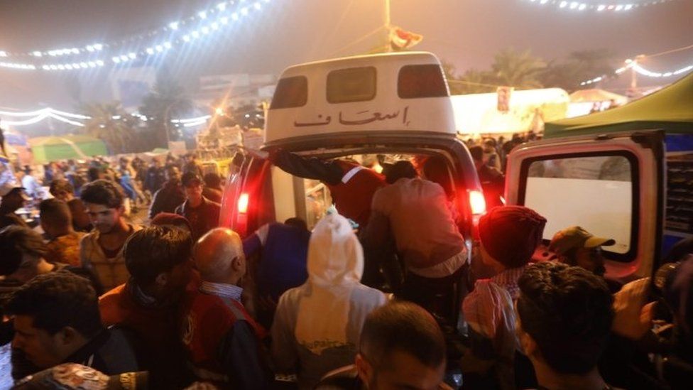Ambulances in the Iraqi capital Baghdad attend to injured protesters