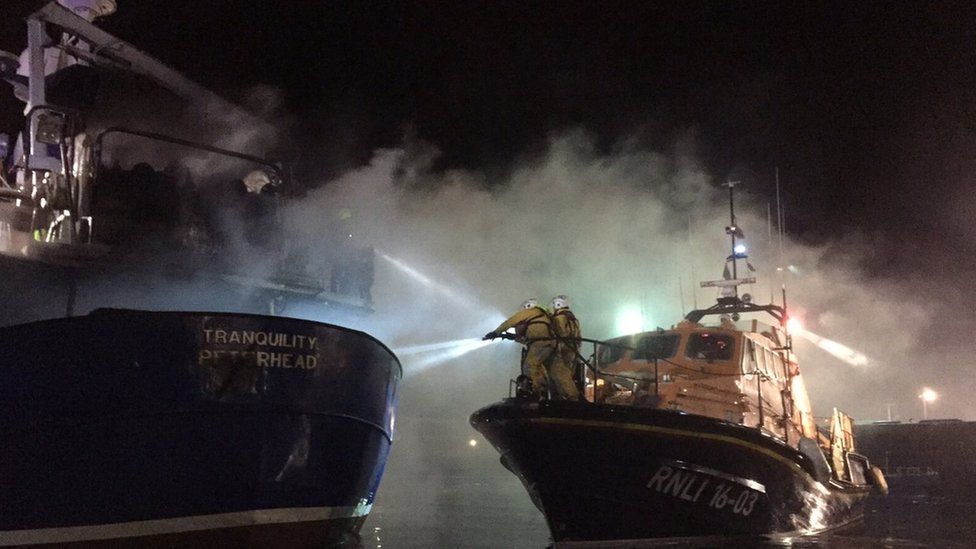 Fishermen rescued from burning boat Tranquility in Peterhead - BBC News