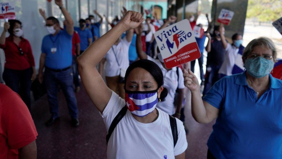 Workers of a state company shout slogans during celebrations of Labour Day