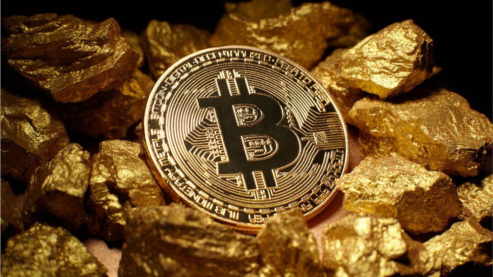 A Bitcoin and gold nuggets