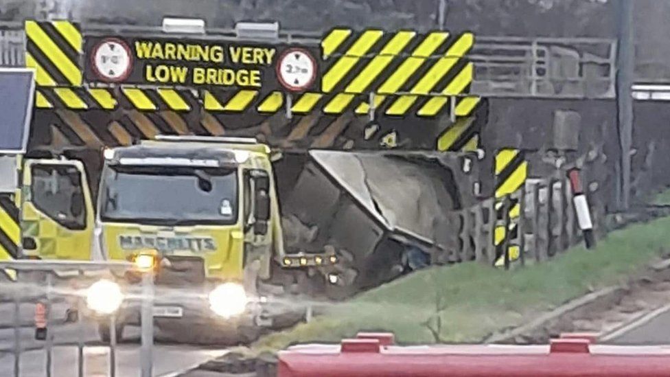 Truck wedged under Ely railway bridge