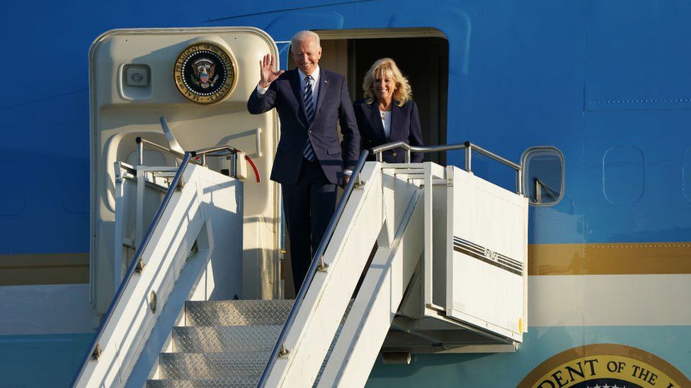 Joe Biden waves after landing in the UK