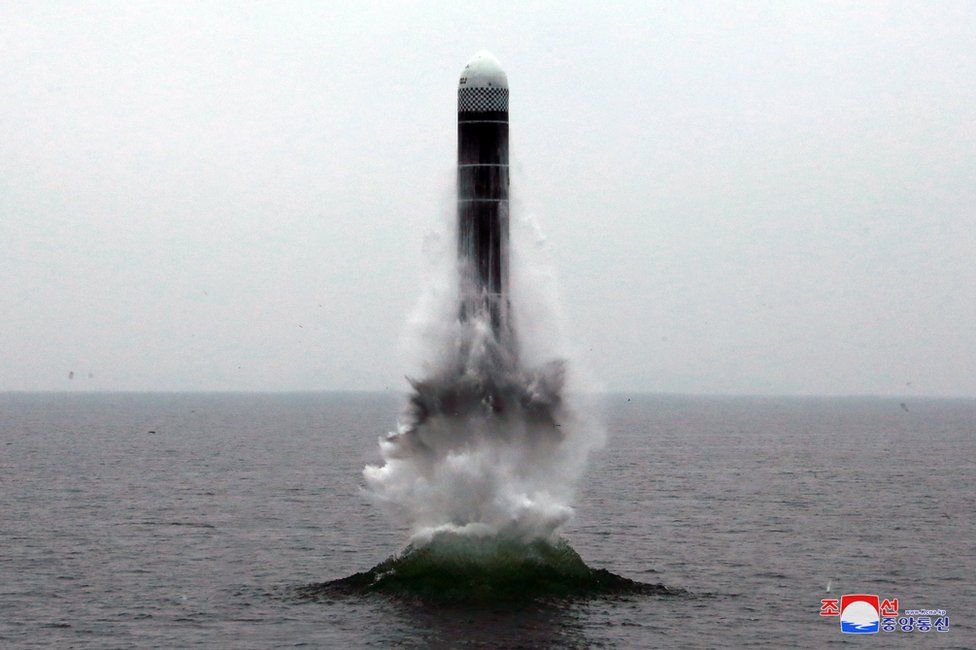 What appears to be a submarine-launched ballistic missile (SLBM) flies in an undisclosed location in this undated picture released by North Korea's official news agency