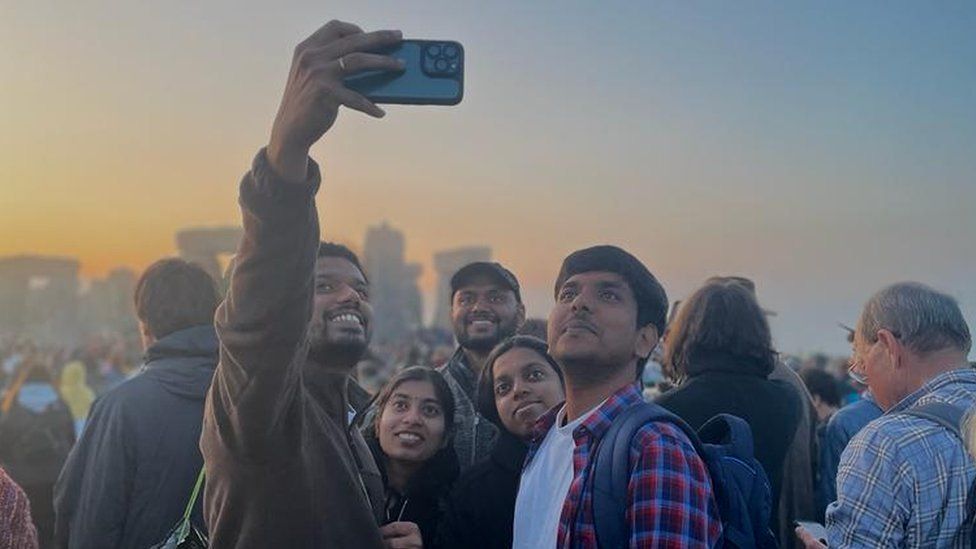 Five people taking a selfie in front of the stones