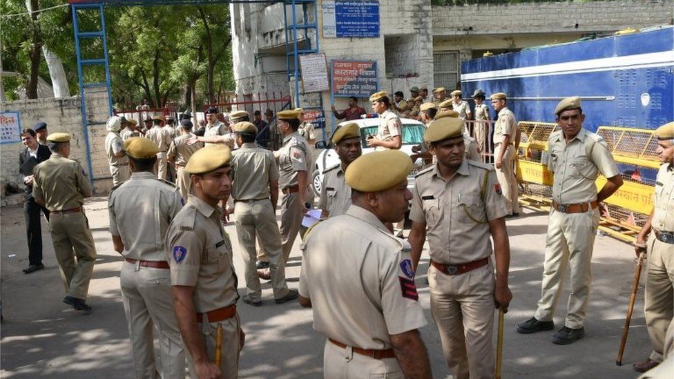 Indian security personal stand guard outside the Jodhpur jail which was converted into the court on 25 April 2018 for the case against self-styled guru Asaram.
