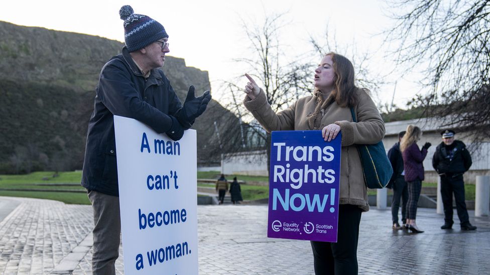 A member of the Scottish Family Party speaks with a supporter of the Gender Recognition Reform Bill (Scotland) during a protest outside the Scottish Parliament, Edinburgh, ahead of a debate on the bill on 20 December 2022