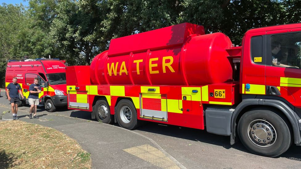 A fire engine and water carrier, in Harlow, Essex