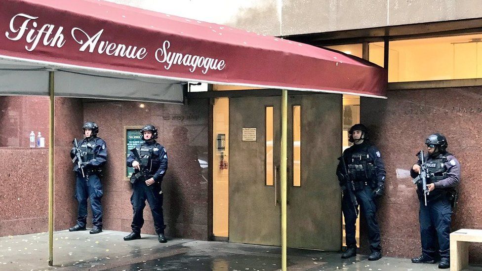Armed police guard a synagogue in New York