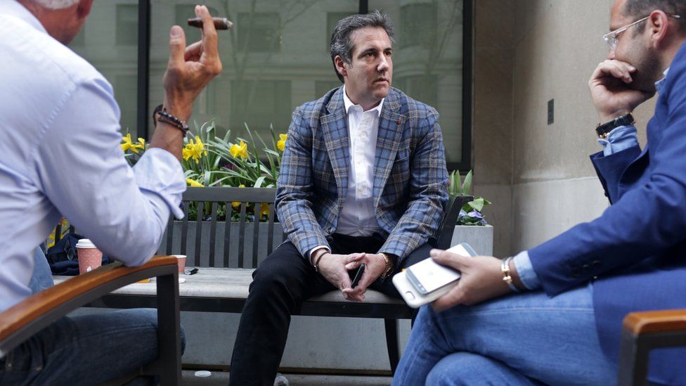 Michael Cohen (C), U.S. President Donald Trump"s personal attorney, chats with friends near the Loews Regency hotel on Park Ave on April 13, 2018 in New York City.