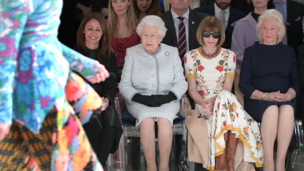 The late Queen centre with Vogue editor-in-chief Anna Wintour and the Queen's dresser Angela Kelly