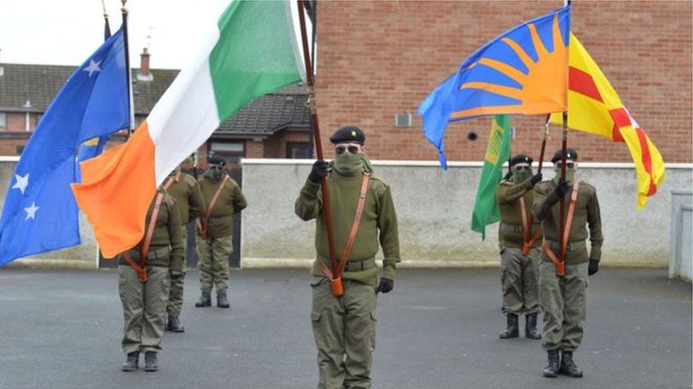 Unionist politicians complained after a number of masked republicans took part in a parade through Lurgan on Saturday