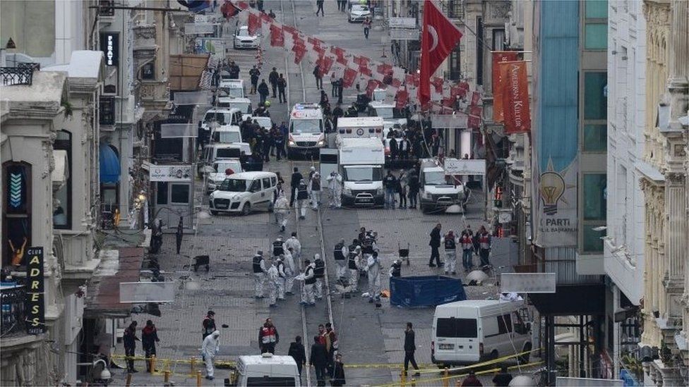 Turkish police, forensics and emergency services, work at the blast scene.