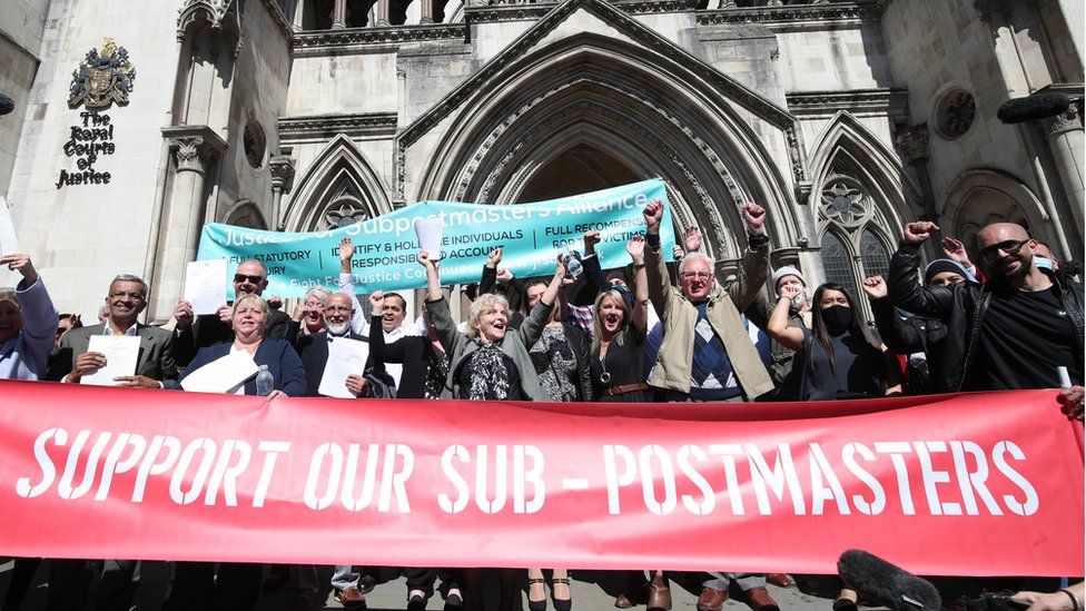 Former post office workers celebrate outside the Royal Courts of Justice, London, after having their convictions overturned by the Court of Appeal in April 2021