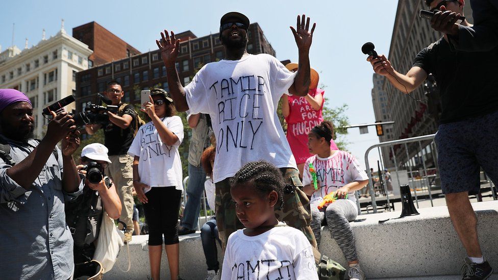 A man protests against the shooting of 12 year-old Tamir Rice by police near the site of the Republican National Convention.