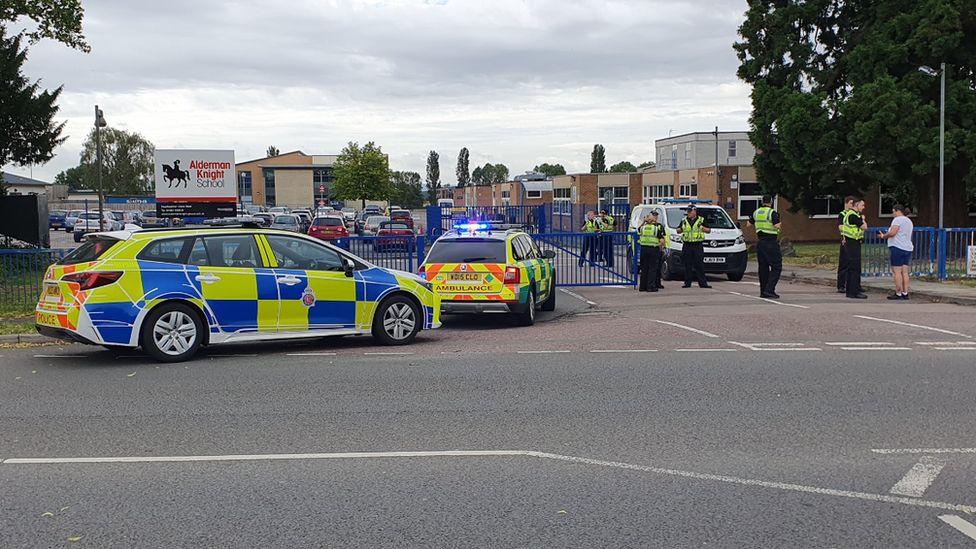 Police vehicles and officers astatine  Tewkesbury School