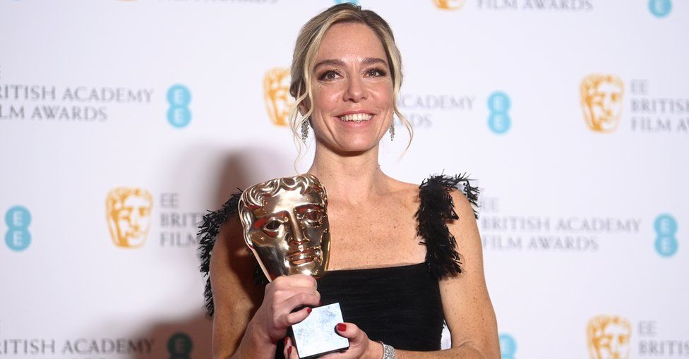 Sian Heder, winner of the Best Adapted Screenplay award for the film CODA, poses in the press room during the 75th BAFTA Film Awards at the Royal Albert Hall in London, Britain, 13 February 2022