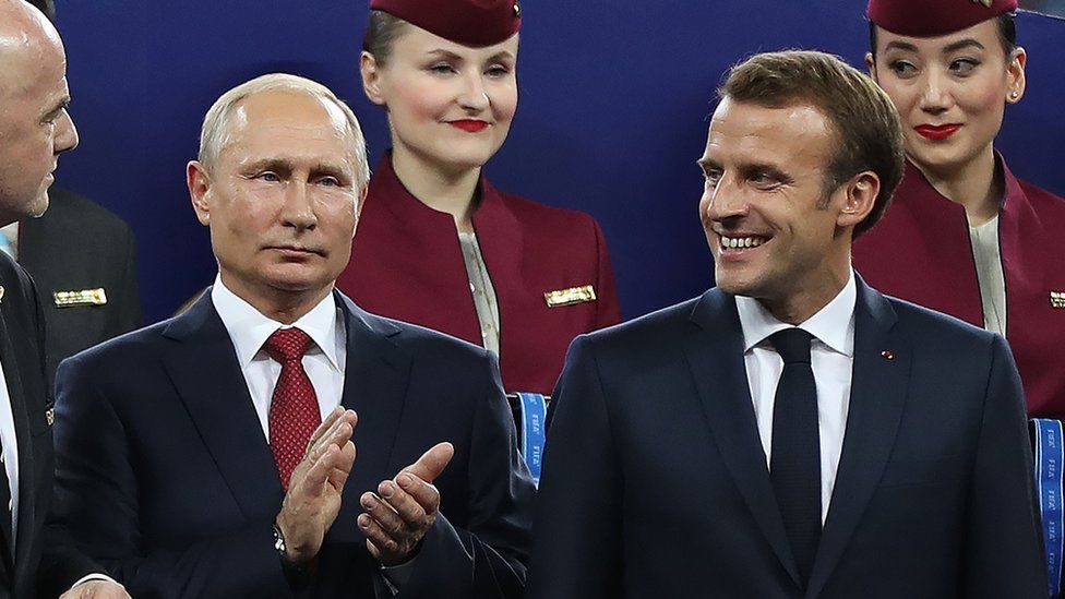 Russian President Vladimir Putin and French President Emmanuel Macron at the 2018 World Cup final