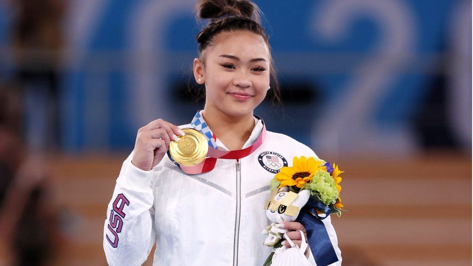 Suni Lee displayed a gold medal at the Tokyo Olympics