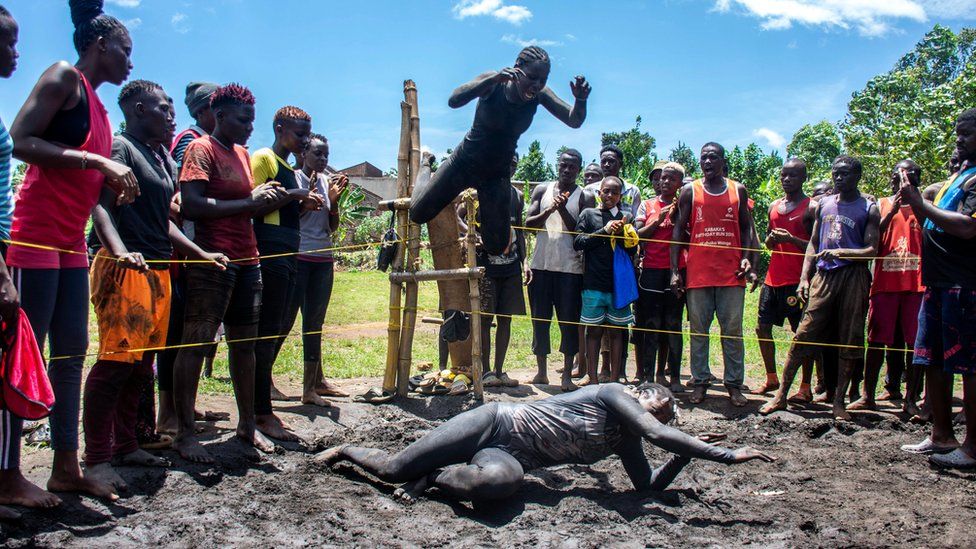 Members of Uganda's Soft Ground Wrestling compete in a makeshift wrestling ring at their camp in the village of Kilangila, Mukono District, Uganda, 06 March 2024.