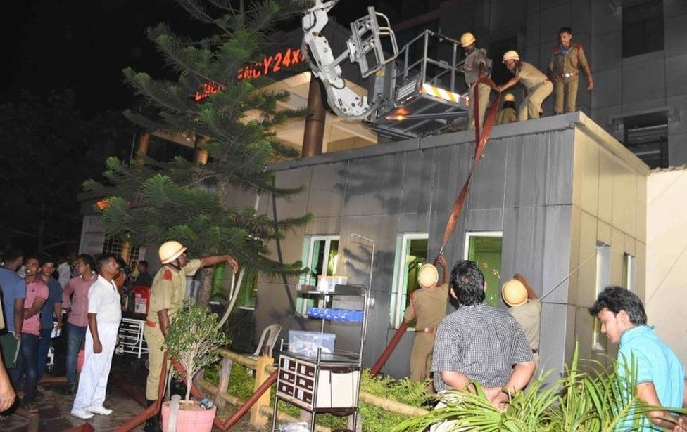 Firefighters try to douse a fire that broke out in the Intensive Care Unit (ICU) of SUM hospital in Bhubaneswar, Orissa, India, 17 October 2016.