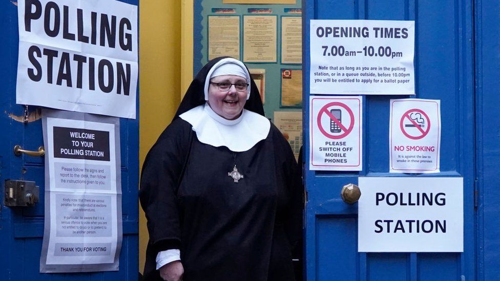 Nun outside a polling station