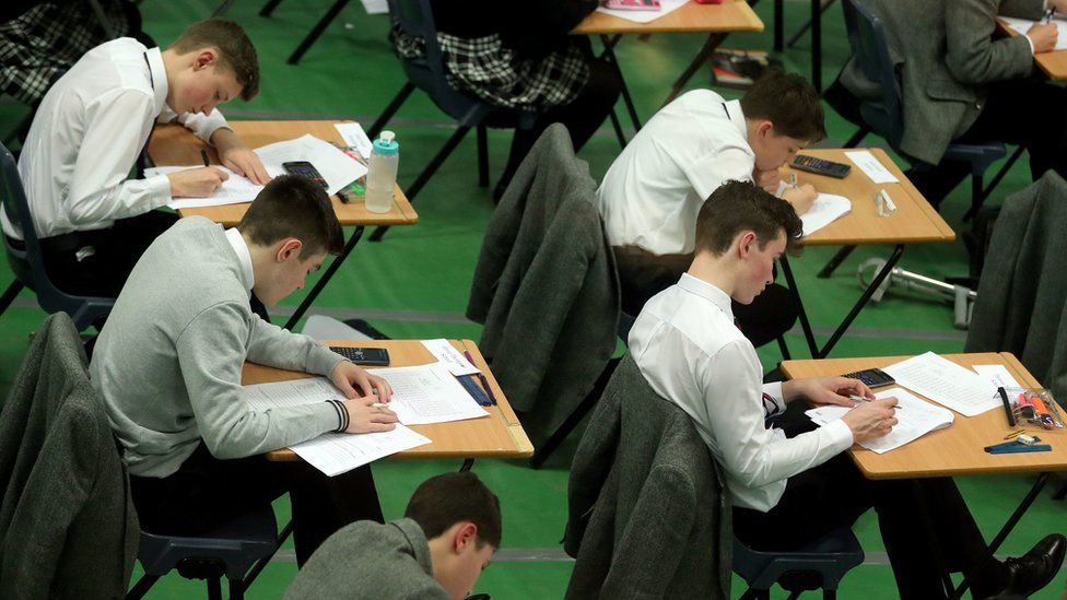 Students doing an exam in a hall