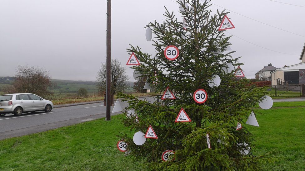 Christmas tree decorated with 30mph signs