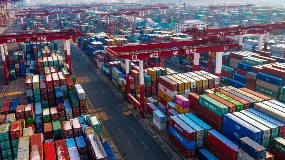 Containers are seen stacked at a port in Qingdao in China's eastern Shandong province.