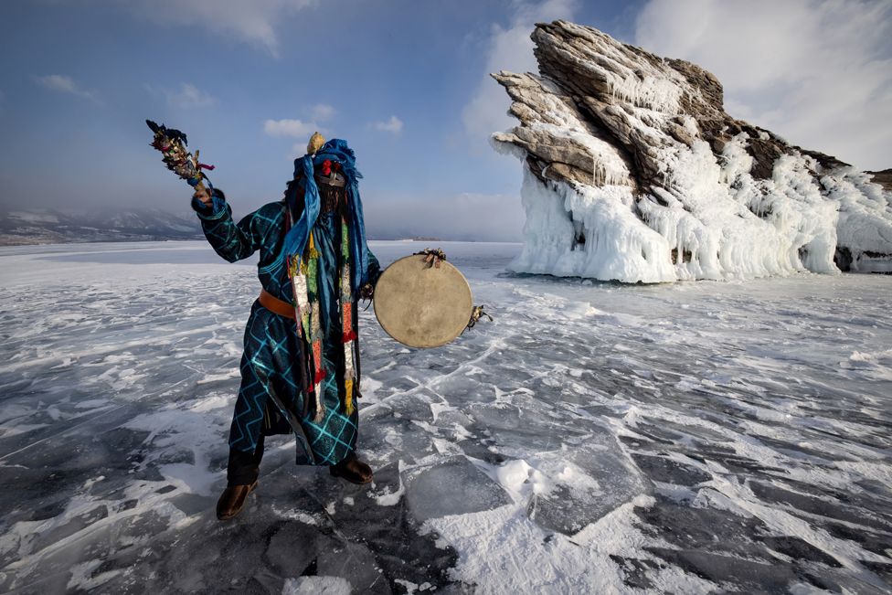 A shaman performing rituals on Siberia's frozen Lake Baikal