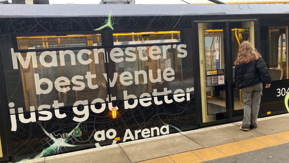 Tran with AO Arena advertising slogan on the side: "Manchester's best venue"