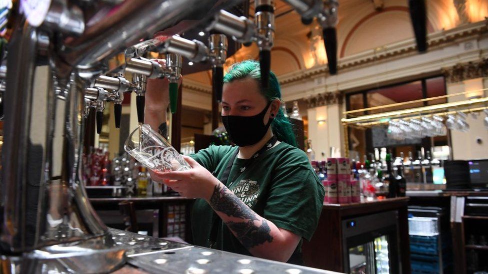 Bartender pulling a pint