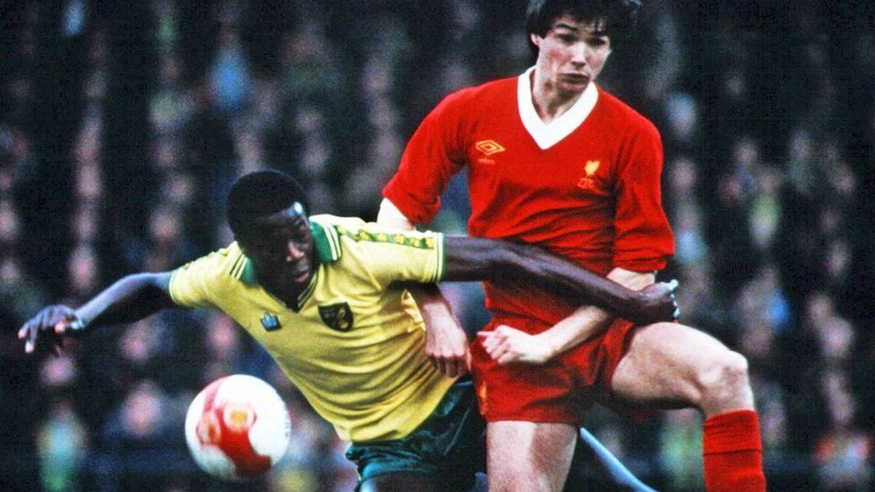 Justin Fashanu and Alan Hansen in match between Norwich and Liverpool in 1980