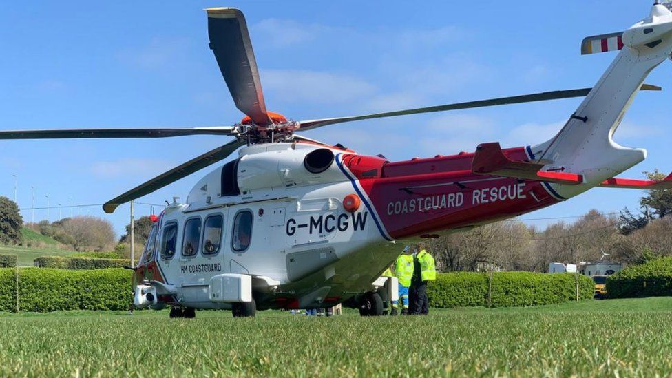 A Coastguard helicopter lands at East Brighton Park