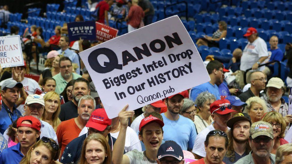 Trump supporters displaying QAnon posters appeared at President Donald J. Trumps Make America Great Again rally Tuesday, July 31, 2018
