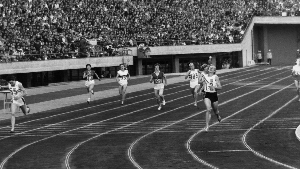 Betty Cuthbert crosses the finish line at the 400 metres final in the 1964 Tokyo Olympics