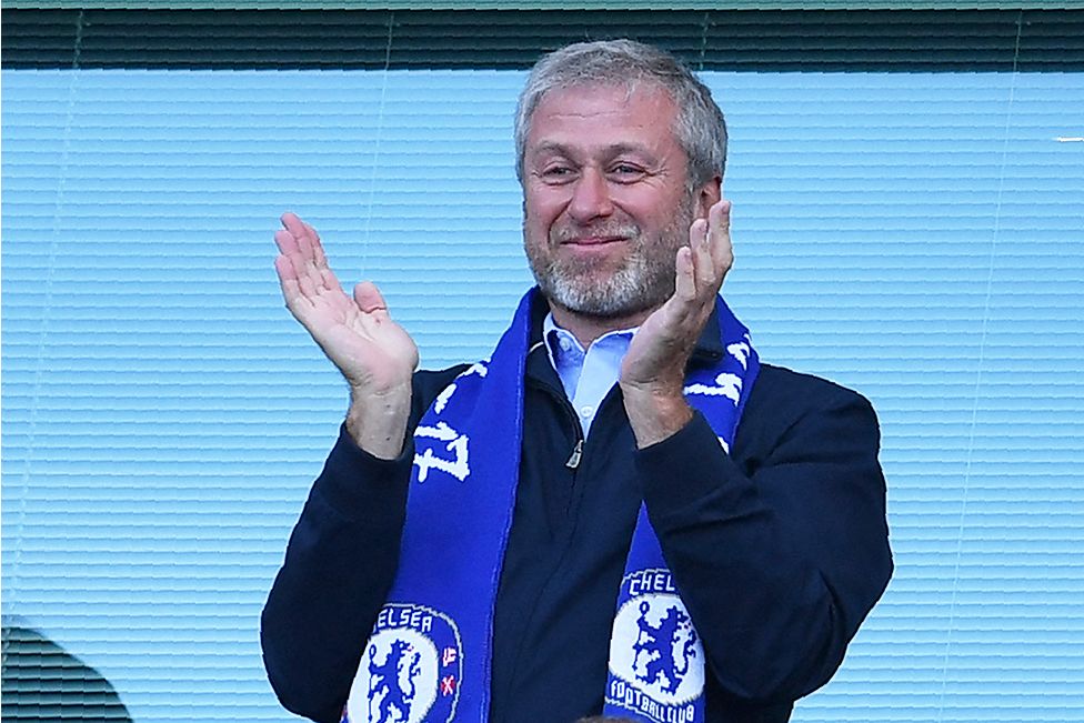Roman Abramovich applauds, as players celebrate their league title win at the end of the Premier League football match between Chelsea and Sunderland at Stamford Bridge in London on May 21, 2017