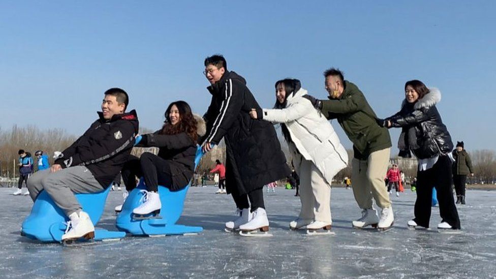 People enjoying the ice in Beijing