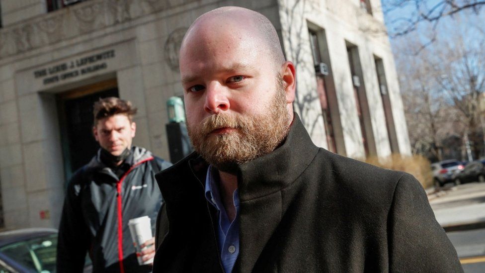 Scotty David walks to a courthouse in New York
