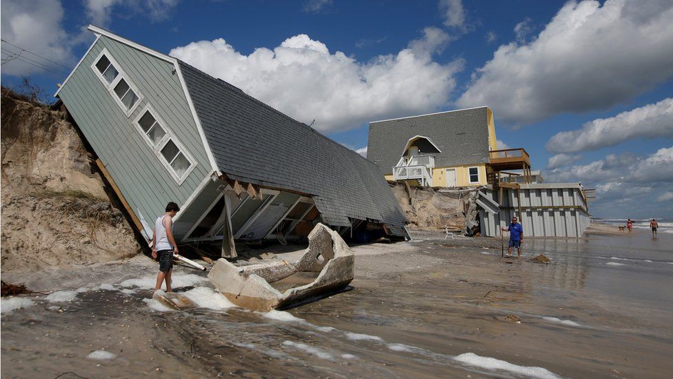 Residents return to collapsed coastal homes after Hurricane Irma passed the area in Vilano Beach, Florida, 12 September 2017