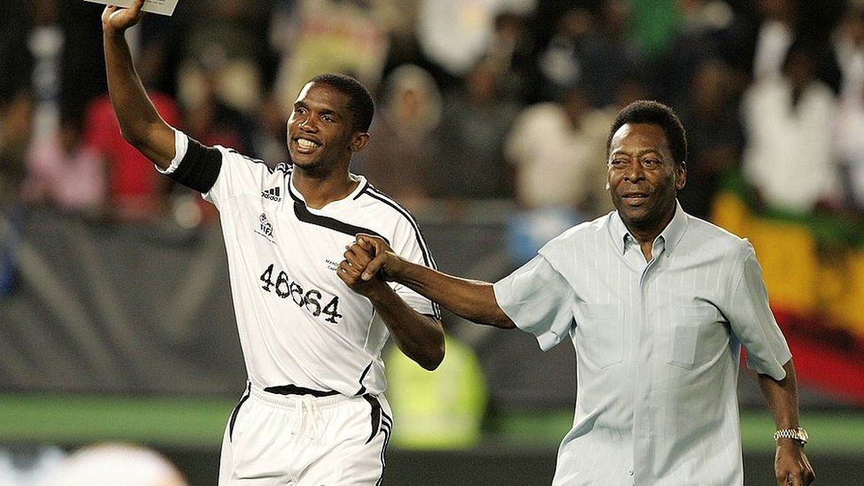 Samuel Eto'o and Pele acknowledge the crowd during during the 